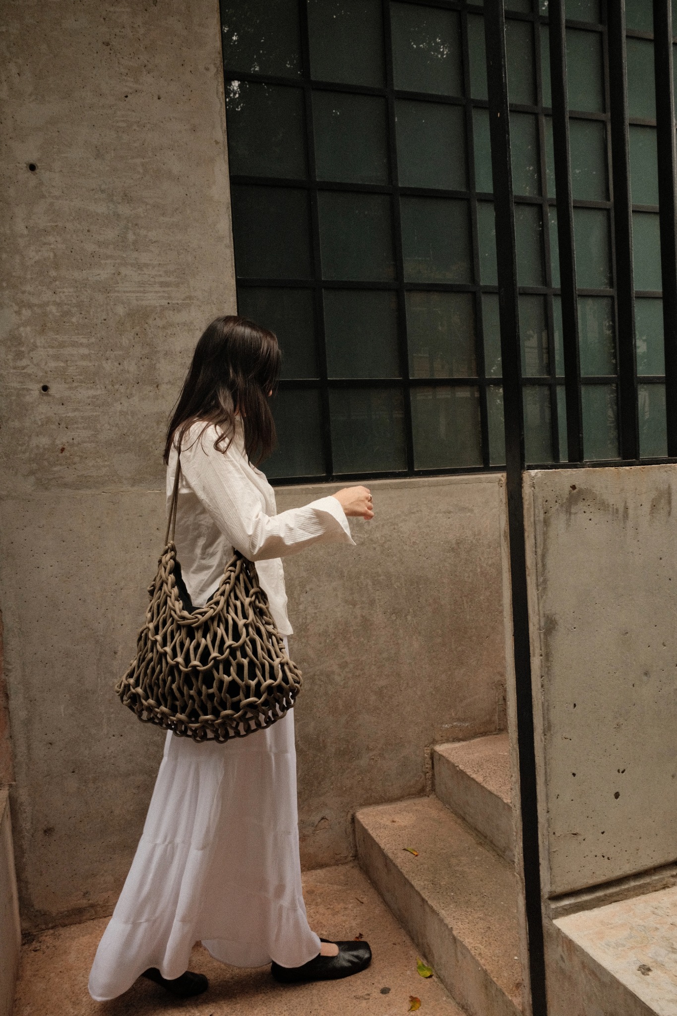 Lifestyle fashion campaign with woven bag