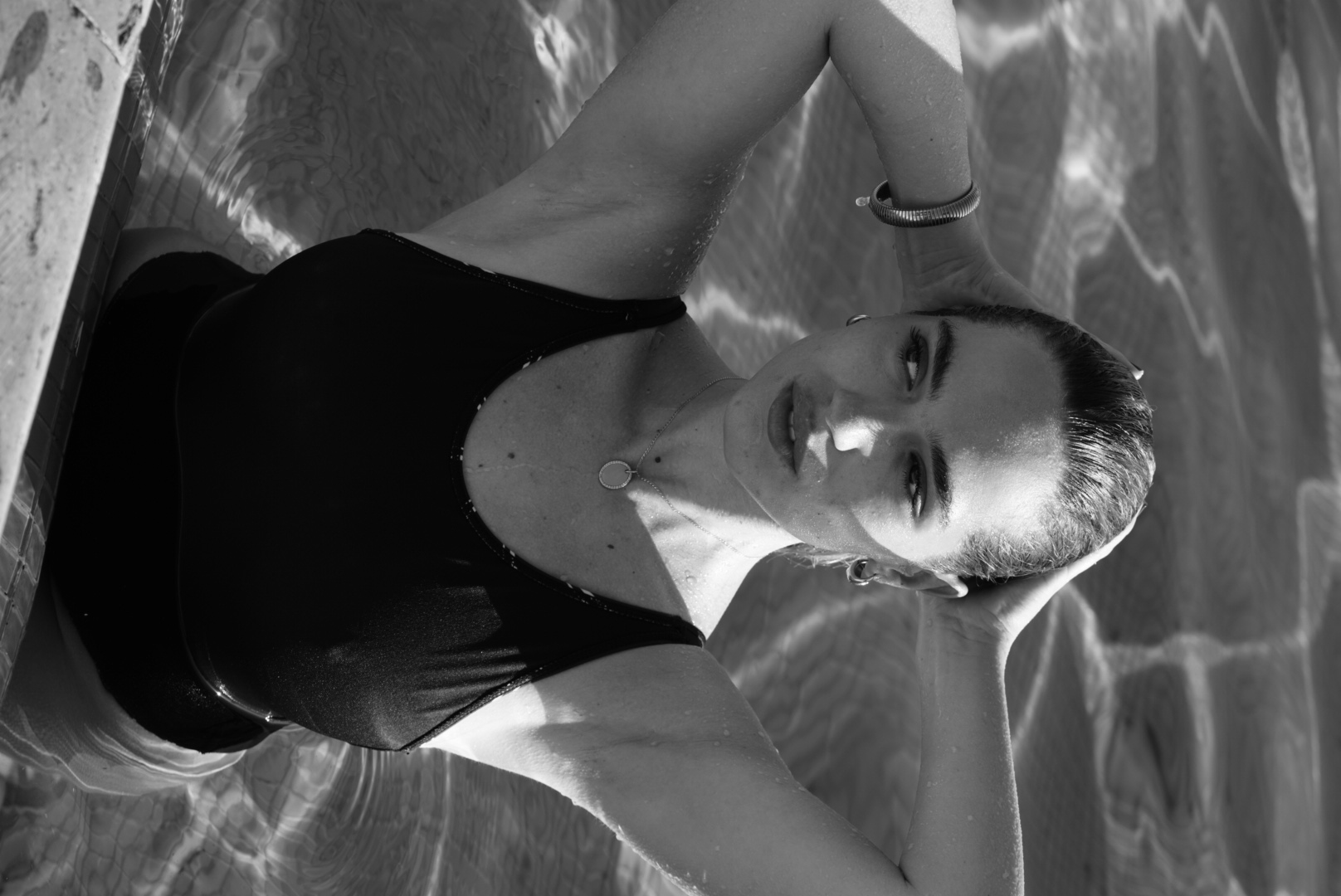 Black and white poolside campaign portrait